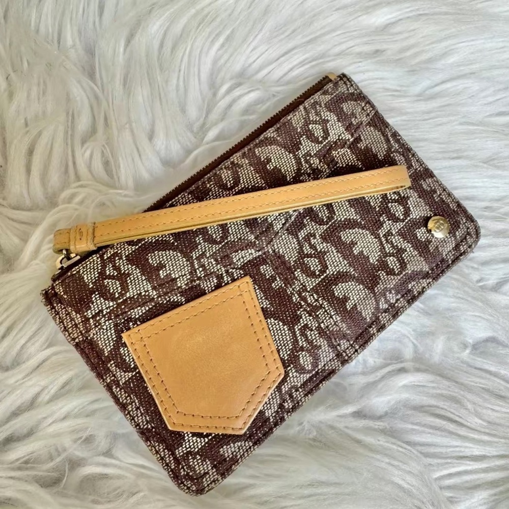 Christian Dior monogram wristlet. Comes with copy of COA from Entrupy